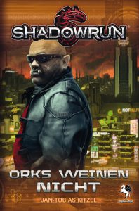 Cover des Shadowrun-Romans "Orks weinen nicht" mit einem Ork mit Sonnenbrille und Lederjacke sowie Gebäude eines Sprawls im Hintergrund, farblich in gelb-grün-braun gehalten